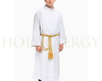 May include: A white clergy alb with long sleeves and a high collar. A gold-colored rope belt with tassels is tied around the waist. The text "HOLY CLERGY" is visible in the background.