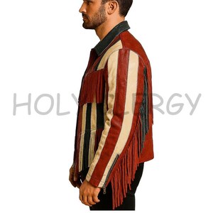 May include: A red, cream, and black leather jacket with fringe detailing. The jacket has a striped design and a zipper closure. The text "HOLYERGY" is visible on the jacket.
