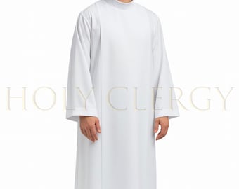 May include: A white clergy robe with long sleeves and a high collar. The robe has a simple, elegant design with a vertical panel on the front. The text "HOLY CLERGY" is visible in the lower portion of the image.
