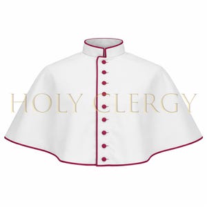 May include: White clerical cape with a high collar and a row of red buttons down the front. The edges are trimmed with red piping. The text "HOLY CLERGY" is printed across the front of the cape.