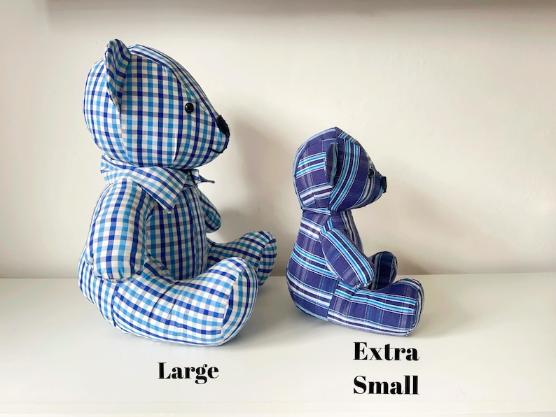 May include: Two handmade teddy bears in blue and white checkered and striped fabrics. The larger bear is labeled "Large" and the smaller bear is labeled "Extra Small". Both bears are sitting on a white surface.