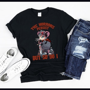 The Horrors Persist But So Do I Possum Shirt – Funny Relatable Possum Tee – Dark Humor Animal Gift – Existential Graphic T-Shirt