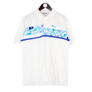 May include: A white ceramic mug with a black handle and the text "But First, Coffee" in a handwritten style. The mug is on a white surface. The mug is approximately 4 inches tall.