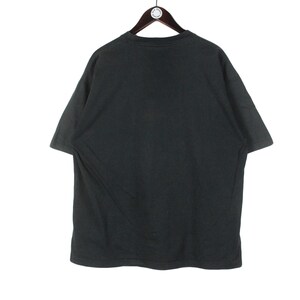 May include: A black short-sleeved t-shirt hanging on a wooden hanger. The shirt is plain and appears to be made of a soft fabric. The background is white.