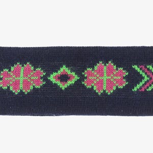 May include: A navy blue knitted headband with a floral and arrow pattern in pink and green. The headband has a matching pink and green cord attached to one end. This accessory is suitable for various activities.