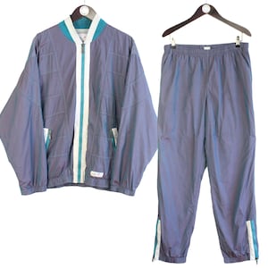 Vintage Ellesse trainingspak maat M blauw jaren 90 retro sportstijl trainingspak jasje en broek jumpsuit