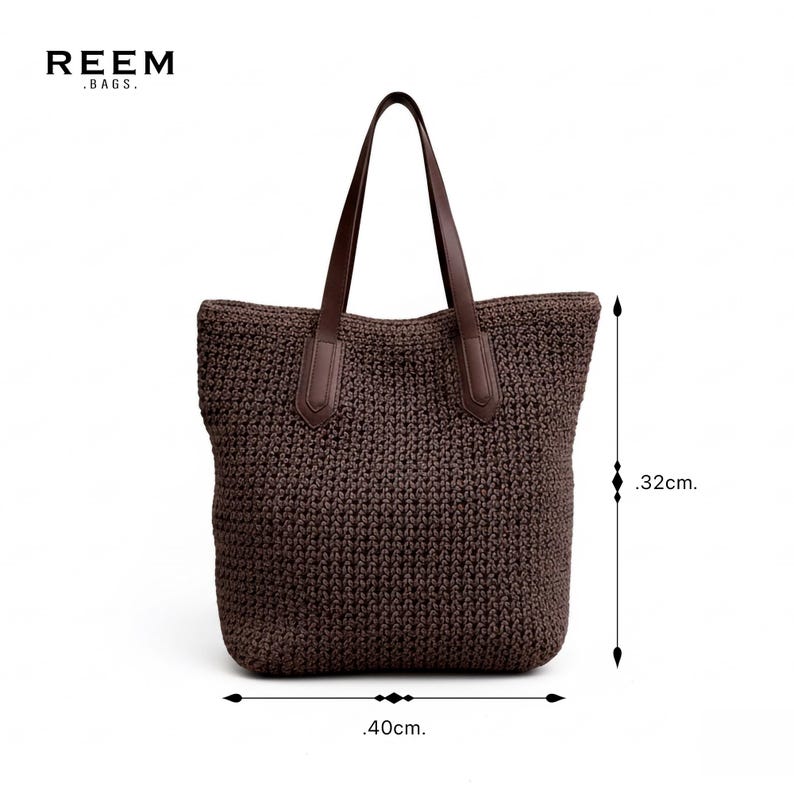 May include: A brown tote bag with leather handles. The bag is made of a woven material and measures approximately 40 cm wide and 32 cm high. The brand name "REEM .BAGS." is visible in the upper left corner.