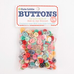 May include: A bag of over 300 colorful, 1/4 inch plastic buttons. The bag is labeled "Cute Little Buttons by Lori Holt of Bee in my Bonnet".