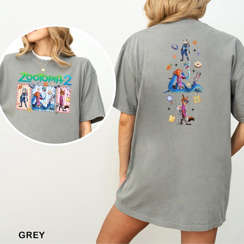May include: A grey t-shirt featuring the text "ZOOTOPIA 2" with cartoon characters on the front. The back of the shirt displays additional characters and icons from the movie. The word "GREY" is printed at the bottom.