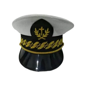 May include: White and black captain's hat with a gold trim and a gold embroidered cross and wreath.
