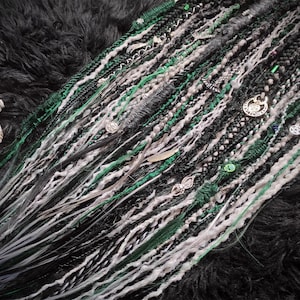 Light Gray Ombre with Dark Green and Emerald Synthetic Dreads and Braids with Witchy Decorations.