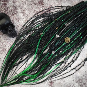 Dark Green with Emerald Synthetic Dreads and Braids with Witchy Decorations.