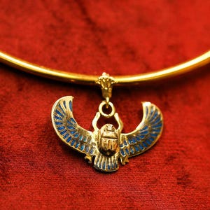 Wings of Transformation: The Winged Scarab Necklace - Symbol of Rebirth, Protection, and Spiritual Evolution