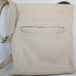 Luxurious Beige Leather Crossbody Bag with Long Adjustable Strap. Unlined Suede Leather Interior. Exterior Slit Pocket. Gender Neutral.