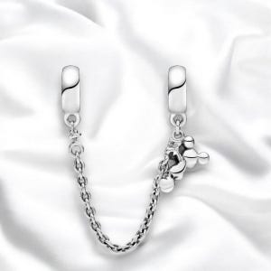 May include: Silver charm bracelet with a Mickey Mouse charm and a chain connector. The charm is made of silver and features a Mickey Mouse head with three round balls.