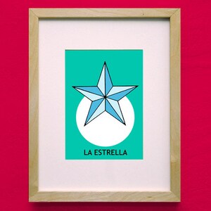 May include: A framed print of a blue and white star with a white circle around it on a teal background. The text "LA ESTRELLA" is printed below the star.