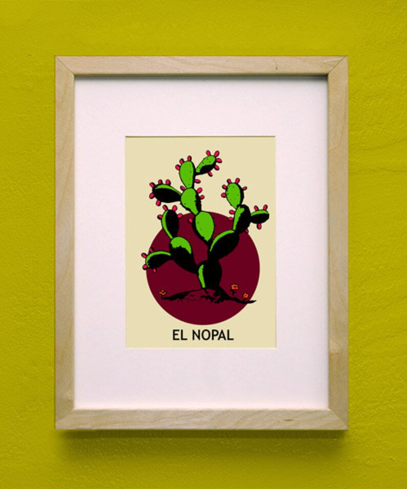 May include: Framed art print featuring a stylized green cactus with red accents against a burgundy circle, with the text "EL NOPAL" below. The print is set against a cream background and framed in light wood.