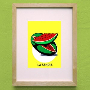 May include: A framed print of a watermelon illustration with the text "LA SANDIA" on a yellow background.