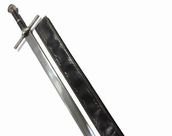 May include: A silver sword with a black leather scabbard. The sword has a cross guard and a pointed tip. The scabbard has a decorative pattern.
