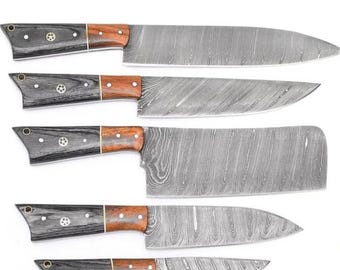 May include: Set of five kitchen knives with wooden handles and Damascus steel blades.
