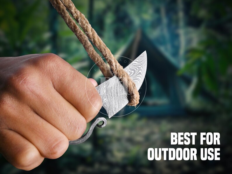 May include: A small, patterned knife with a curved blade is held with a rope. The text "BEST FOR OUTDOOR USE" is displayed in white. The knife has a decorative handle and is set against a blurred green background.