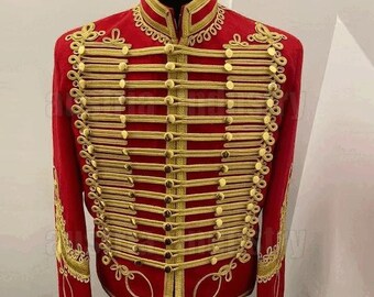 May include: A red jacket with gold trim and buttons. The jacket has a high collar and a stand-up style. The jacket is decorated with gold braid and buttons.