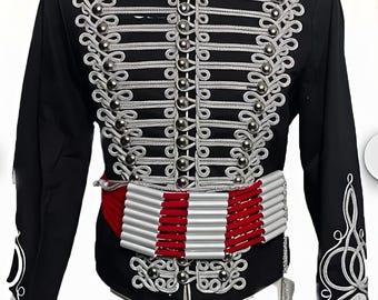 May include: Black military-style jacket with silver and white decorative trim. The jacket features a red collar and cuffs, a silver button closure, and a red and white belt. A tassel hangs from the waist.