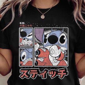 May include: Black t-shirt with a graphic of the character Stitch from Lilo & Stitch. The design includes multiple panels with Stitch's face and Japanese text. The shirt has short sleeves and a crew neck.