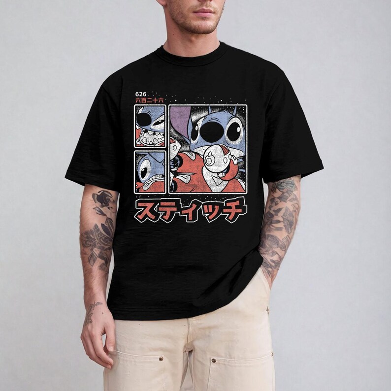 May include: Black t-shirt with a graphic of a blue alien character and a red alien character in a four-panel design. The graphic includes Japanese text and the number "626".