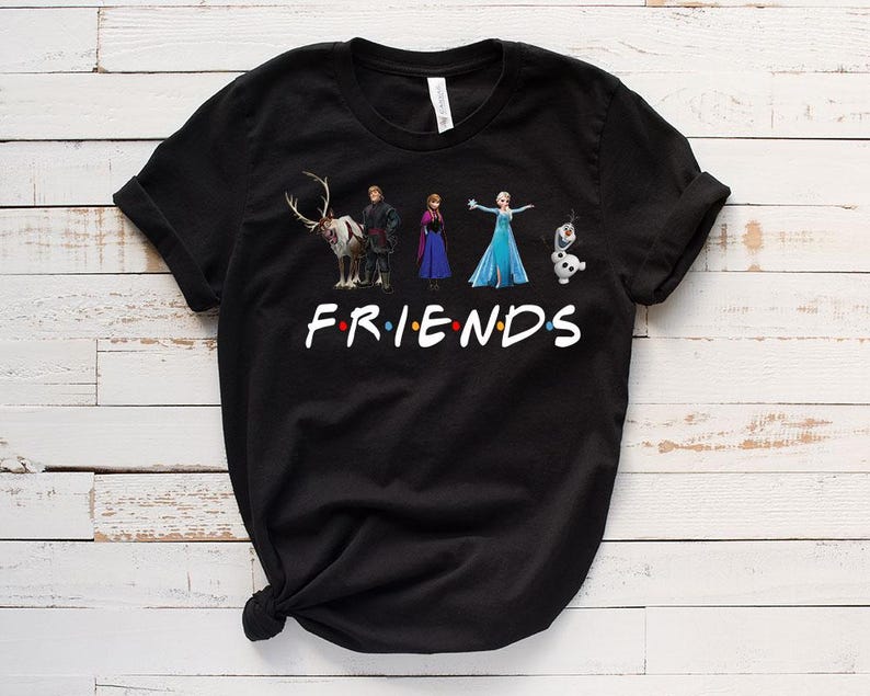 May include: Black t-shirt with a graphic of characters from the movie Frozen. The graphic includes Elsa, Anna, Kristoff, Sven the reindeer, and Olaf. The text "FRIENDS" is below the graphic.