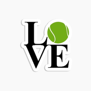 May include: A black and white sticker with the word "LOVE" in large letters. A green tennis ball is in the center of the word.