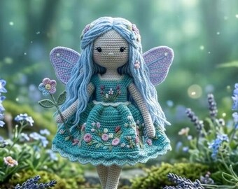 May include: A crocheted doll with long light blue hair, wearing a teal dress with floral embroidery and small purple wings. The doll has a cream-colored complexion, holds a single small flower, and stands on a stone path surrounded by flowers.