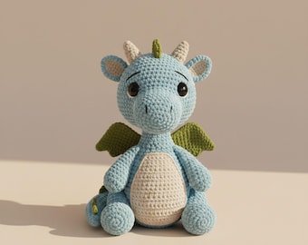 May include: A handmade crochet dragon in light blue, with a cream-colored belly and green wings. The dragon has large, dark eyes and small horns. This soft toy is a charming addition to any nursery or child's room.