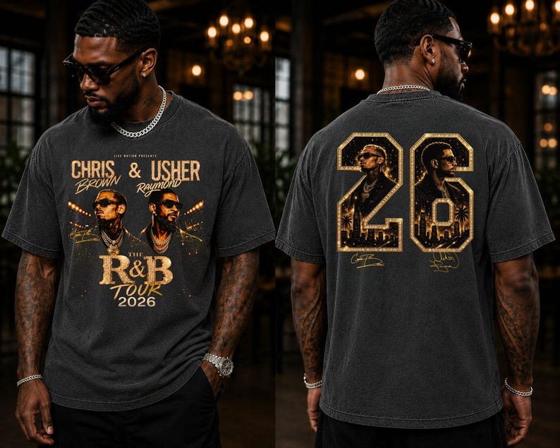 May include: A charcoal gray t-shirt featuring a graphic print of Chris Brown and Usher with the text The R&B Tour 2026 on the front. The back displays the number 26 in a gold glitter style, framing portraits of the artists and city silhouettes.