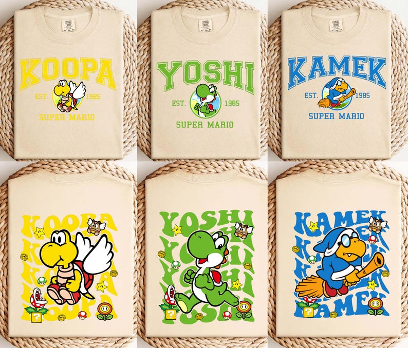 May include: Six beige t-shirts with Super Mario character designs. Each shirt features a different character name in a collegiate font: Koopa, Yoshi, and Kamek. The designs include character illustrations, the text "EST. 1985", and the words "SUPER MARIO".