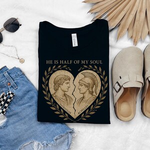 a pair of shoes, a t - shirt, and a pair of denim shorts