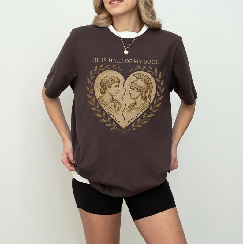 a woman wearing a t - shirt that says he's half of my soul