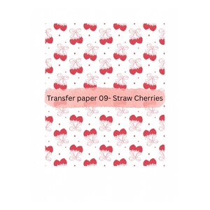 May include: A white background with a repeating pattern of red cherries with white stems and bows. The text "Transfer paper 09- Straw Cherries" is written in a pink watercolor font.