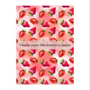 May include: A repeating pattern of red strawberries with green leaves on a pink and white background. The text "Transfer paper 296 strawberry season" is displayed across the image.