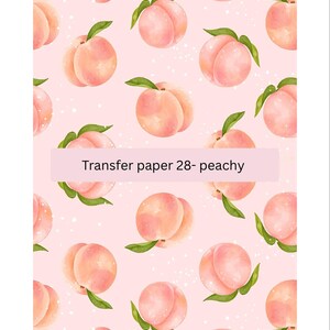 May include: A pink background with a repeating pattern of peach fruit with green leaves. The text "Transfer paper 28- peachy" is at the bottom of the image.