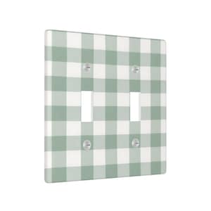 May include: A double light switch cover with a green and white gingham pattern. The cover has two switch openings and four silver screws. The design is a classic, country-style aesthetic.