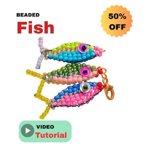 May include: Three beaded fish in shades of blue, green, and pink, with yellow fins and a gold-colored clasp. The fish have large, round eyes. Text on the image reads "BEADED Fish", "50% OFF", and "VIDEO Tutorial".
