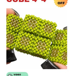 May include: Close-up of beaded cube jewelry. The cubes are lime green with gold accents, and the text "BEADED CUBE 4*4" is displayed in red. A "50% OFF" sticker is also visible. A video tutorial is available.