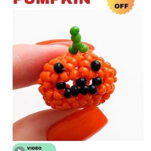 May include: A beaded orange pumpkin with black accents and a green stem. The word "PUMPKIN" is in red block letters above the pumpkin. The words "50% OFF" are in a yellow starburst. A video tutorial is available.