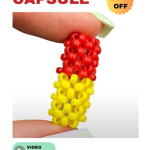Könnte beinhalten: Eine Perlenkapsel in Rot und Gelb, gehalten zwischen Fingern. Das Wort "CAPSULE" steht in roten Blockbuchstaben über der Kapsel. Ein "50% OFF"-Aufkleber befindet sich in der oberen rechten Ecke. Ein Video-Tutorial ist verfügbar.