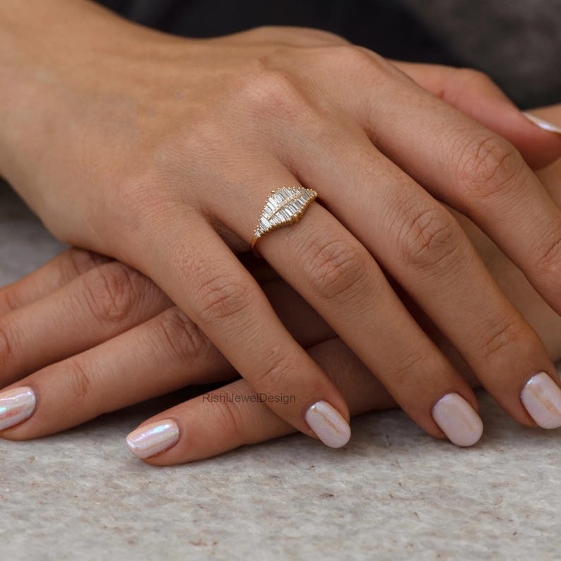 Modern heirloom baguette diamond ring styled for bridal and anniversary jewelry