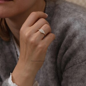 Fine jewelry gold ring featuring natural baguette diamonds and architectural silhouette