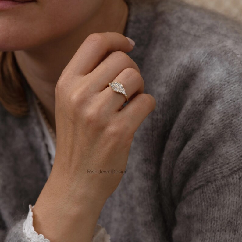 Fine jewelry gold ring featuring natural baguette diamonds and architectural silhouette
