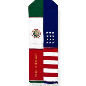 May include: A graduation stole with the American and Mexican flags on it. The text "CONGRATS GRAD" is embroidered on the Mexican side of the stole.