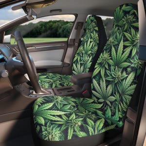 May include: Green car seat covers with a marijuana leaf pattern. The covers are made of a soft, comfortable fabric and are easy to install.